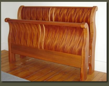 Our Ribbon Mahogany Crowley Sleigh Bed features shop-sawn ribbon mahogany veneers