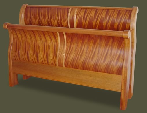 Our custom made ribbon mahongany sleigh bed makes a unique and attractive addition to any home decor