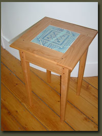 Our cherry end table can be personalized to your needs -- consider an inlaid handpainted tile for a highly decorative look