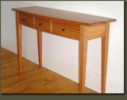 Our Bowfront Hall Table made with Cherry Wood and Recycled Cypress from our Rheingold Vat Wood collection