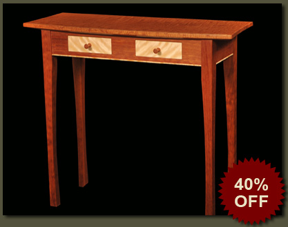 A curved mahogany top, long mahogany legs, and figured flame birch drawer fronts provide the visual punch for our Bristol Hall Table, an entry hall table which is sure to gain the admiring attention of all who visit your home.